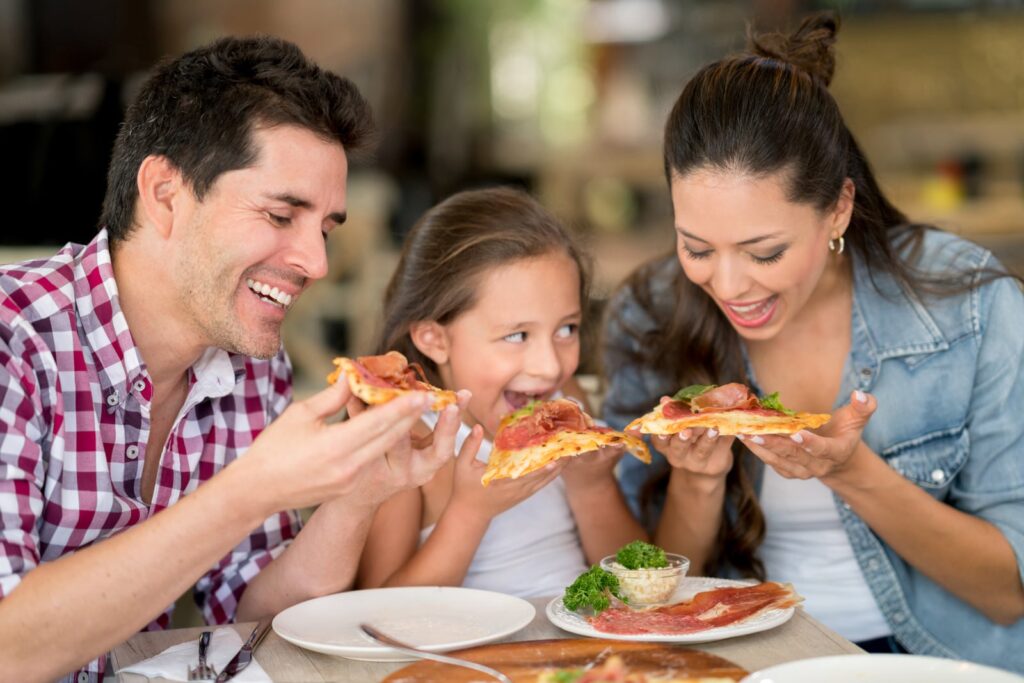 Family enjoying food at Georgetown KY pizza restaurant - Mancino’s Pizza and Grinders Family enjoying food at Georgetown KY pizza restaurant